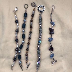 Five beaded bracelets